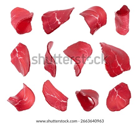 Set of thinly sliced ​​dried meat isolated on white background