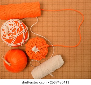 Set of threads for knitting and macrame weaving. Woven various pumpkins, handwork, autumn hobby concept