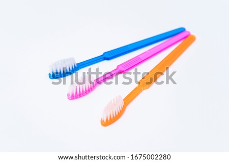 Set of three colorful toothbrushes