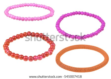 Set of three elastic bracelets made of pearl-like round beads (pink, purple and red) and one orange metallic elastic bracelet, isolated on white background, clipping path included