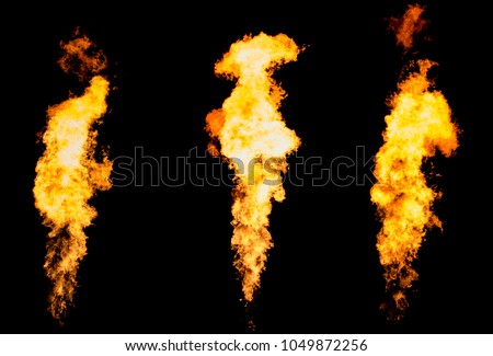 Set of three isolated fire pillars. Flame tongue goes from gas burner.
