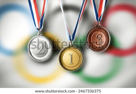 Set of three medals hanging with blue white and red ribbon.