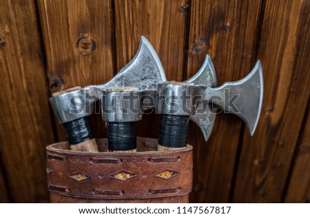 Set of three throwing axes in leather sheath