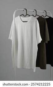 Set of three t-shirts on a hanger t-shirt mockup, white t-shirt mockup