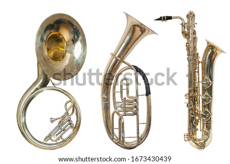 set of three wind musical instruments, classic wind instrument sousaphone, classic wind musical instrument saxophone and baritone Euphonium, isolated on a white background