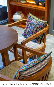 Set Of Throw Pillows And Table And Chair Furniture In Ethnic Style