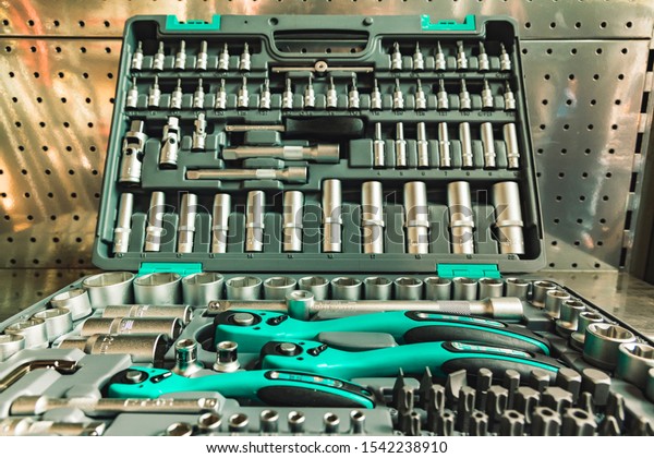 set of tools for\
car repair with wrench screwdriver clutch and different nozzles,\
background picture