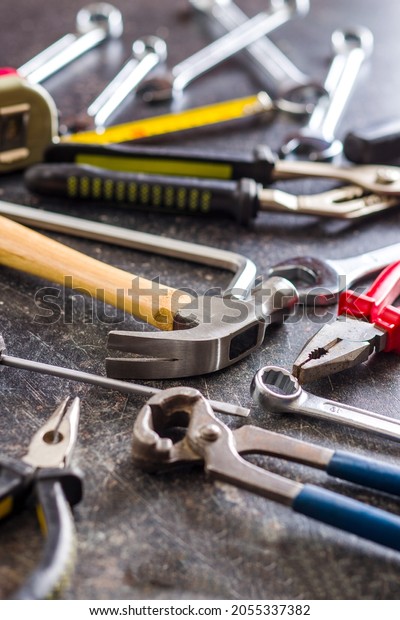 Set of\
tools. Hand tools for craftsmen on old\
table.