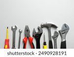 Set of tools on gray background, top view