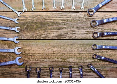 Set of tools on the wood background.