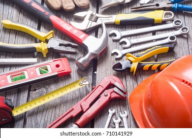 Set of tools on wooden background .