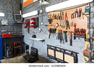 A set of tools in the real auto repair shop. The organization of the workplace at the mechanic. - Powered by Shutterstock