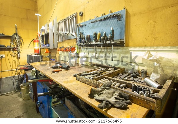 A set of tools in the real\
auto repair shop. The organization of the workplace at the\
mechanic.