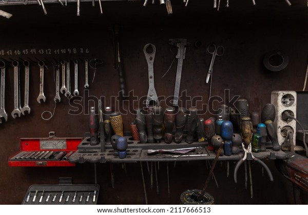 A set of tools in the real
auto repair shop. The organization of the workplace at the
mechanic.