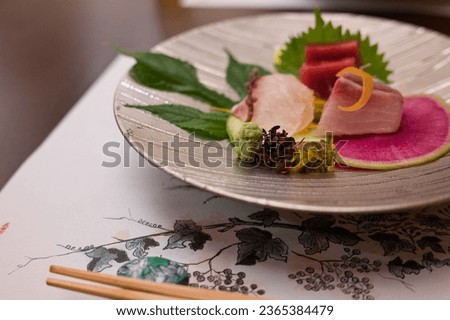 A set of traditional Japanese cuisine and sushi raw fish on fine dining table at luxury restaurant in Tokyo, Japan