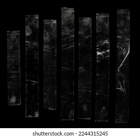 set of transparent adhesive tape or glue strips isolated on black background, crumpled plastic sticky snips, real macro photo.