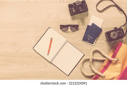 Set Of Travel Things On Wooden Background. Accessories And Essential Journey Items, Copy Space For Text, Summer Vacation Planning And Wanderlust Concept