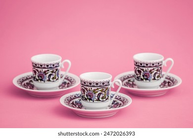 Set of Turkish coffee cups with paisley pattern on pink background. - Powered by Shutterstock
