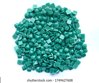 Set of turquoise diamonds for diamond embroidery isolated on white background. Hobbies and DIY, materials for creating diamond embroidery.
