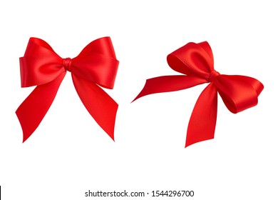 Set of two beautiful ornate perfect holiday handmade gift bows made of bright red silk ribbon taken from different angles isolated on a white background. Closeup, clipping path. - Shutterstock ID 1544296700