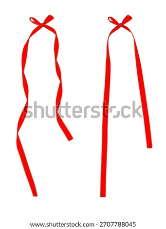 Set of two long, vertical red ribbons tied with small bows, isolated on a white background, perfect for hanging elements, tags, banners, or decorative stringing