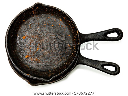 Set of Two Rusty Cast Iron Skillets over white.