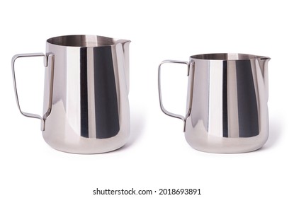 Set of two stainless Steel Milk Pitchers (Foaming Jugs) isolated on white background with clipping path. Coffee Accessories. 