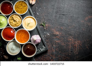 Set of a variety of sauces. On dark rustic background