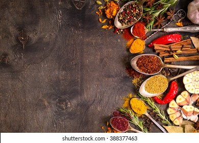 Set of various aromatic colorful spices in old vintage spoons and herbs on a dark wooden background. Space for text. Food frame. Ingredients for cooking. Top view - Powered by Shutterstock