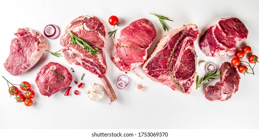 Set of various classic, alternative raw meat, veal beef steaks - chateau mignon, t-bone, tomahawk, striploin, tenderloin, new york steak. Flat lay top view on white table background - Shutterstock ID 1753069370