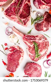 Set of various classic, alternative raw meat, veal beef steaks - chateau mignon, t-bone, tomahawk, striploin, tenderloin, new york steak. Flat lay top view on white table background - Shutterstock ID 1753069379
