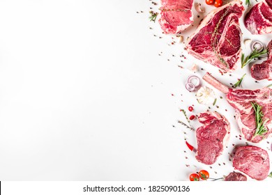 Set of various classic, alternative raw meat, veal beef steaks - chateau mignon, t-bone, tomahawk, striploin, tenderloin, new york steak. Flat lay top view on white table background