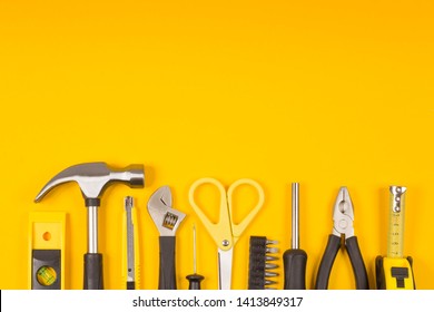 Set Of Various Construction Tools. Tools For Home Repair. Work At A Construction Site. On A Yellow Background. Flatly. Flatlay.