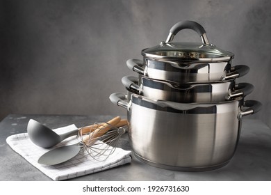set of various cookware and utensils on dark background. recipe book, cooking classes concept. space for text