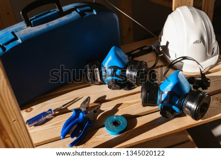 Set of various different tools in sunlight. Plastic tools kit, hammer, drill, gloves. Construction and home renovation concept with copy space