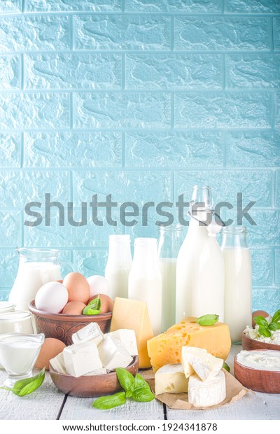 Set
of Various Fresh Dairy Products - milk, cottage cheese, cheese,
eggs, yogurt, sour cream, butter on wooden
background