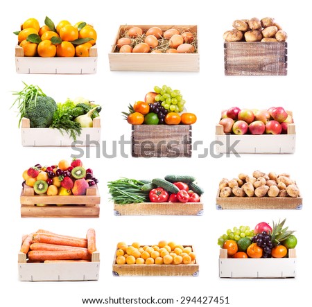 set of various fruits and vegetables in wooden box on white background