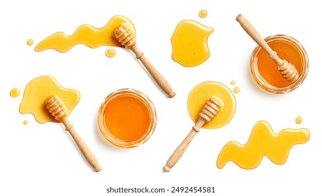 Set of various honey jars and wooden dippers with honey spill, splash and drop isolated on white background, top view