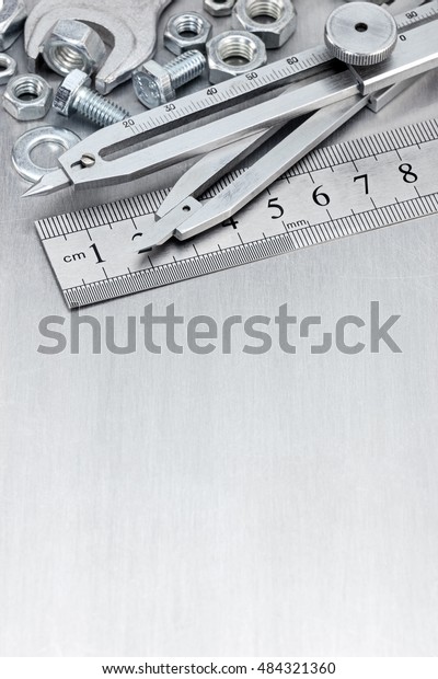 set of various measure tools\
for house repair and construction on scratched metal\
background