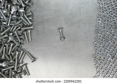 A Set Of Various Nuts, Bolts, Screws On The Background Of A Steel Plate. Locksmith Business.