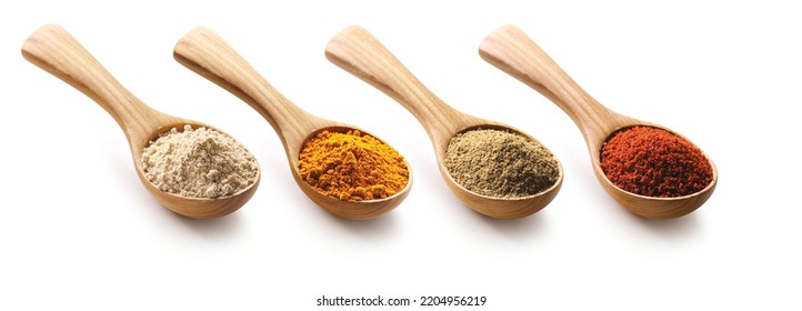 Set of various powder spices in a wooden spoon isolated on white background. Collection of close-up wooden spoons with curry, tumeric, cumin, pepper powder. Clipping path. - Powered by Shutterstock