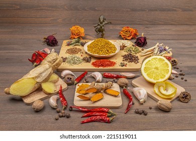 Set Of Various Spices On Wooden Planks. A Variety Of Spices From India. Spices In Ayurveda.  Food Decoration Design. Peppers And Herbs Close-up. A Set Of Pepper, Salt, Herbs And Spices For Cooking.