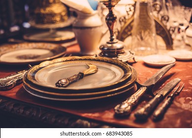 Set Of Vintage Dinnerware On Red Table, Toned