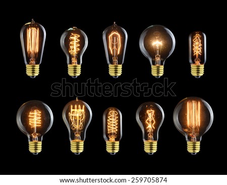 Set of vintage glowing light bulbs on black