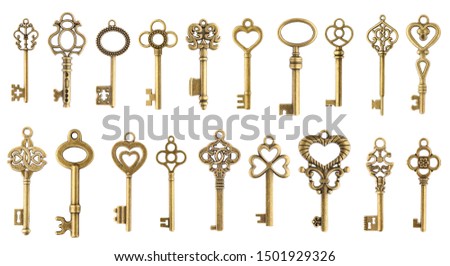 Set of vintage golden skeleton keys isolated on white background