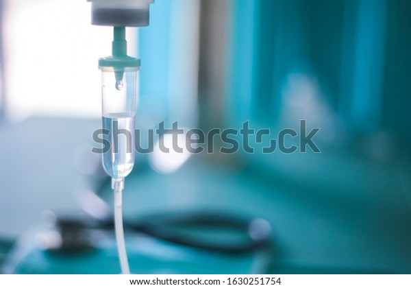 Set vitamin iv fluid intravenous drop saline drip\
hospital room Medical Concept treatment emergency and injection\
drug infusion care chemotherapy  concept.blue light background\
selective focus