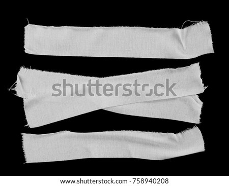Set white adhesive bandage isolated on black background, top view