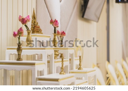 Set of white altar table and monk 's seats in house ceremony celebrate for new house,buddha statue placed on the altar table.Thai culture and religion in Thailand.