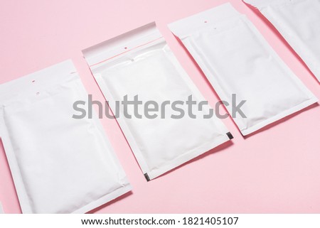 Set of white paper bubble envelopes for postal shipping