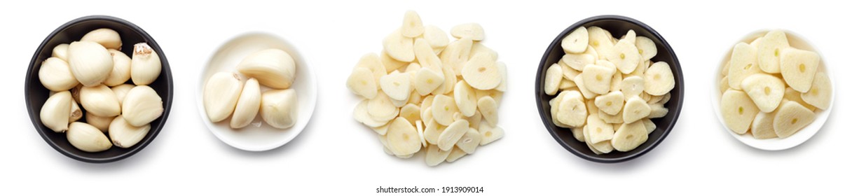 Set of whole and chopped garlic cloves and slices isolated on white background, top view